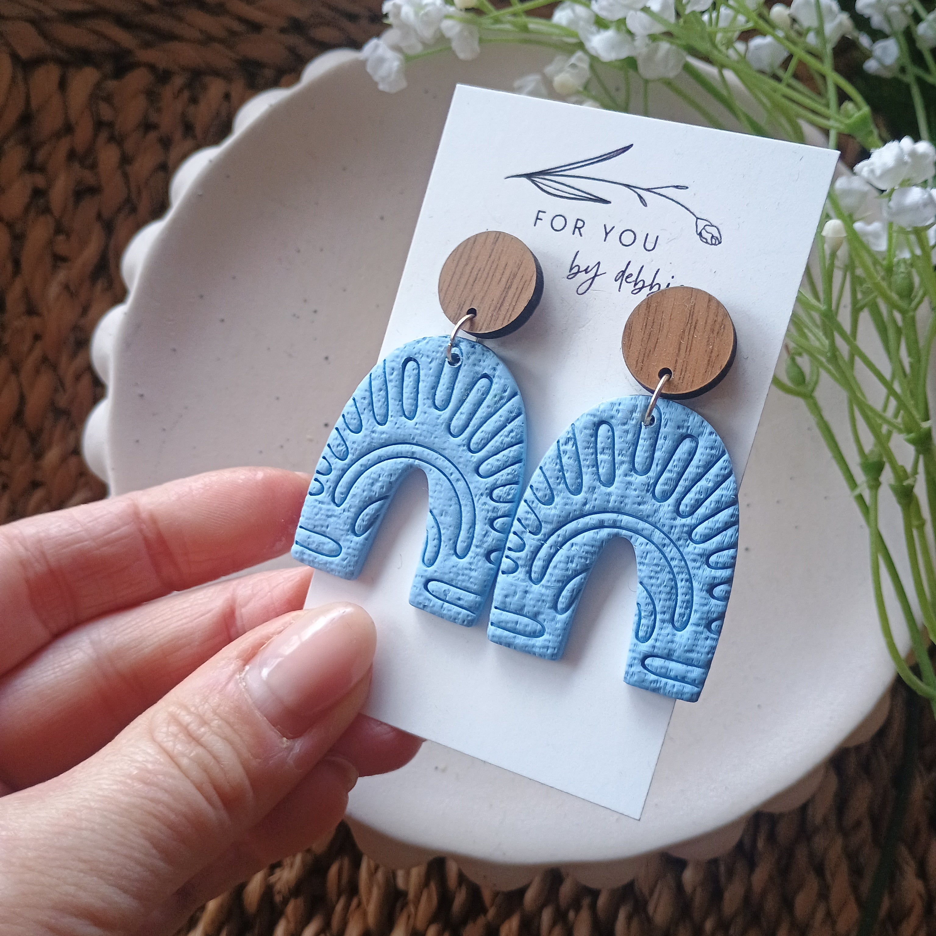 Embossed blue arch earrings with natural wood stud top