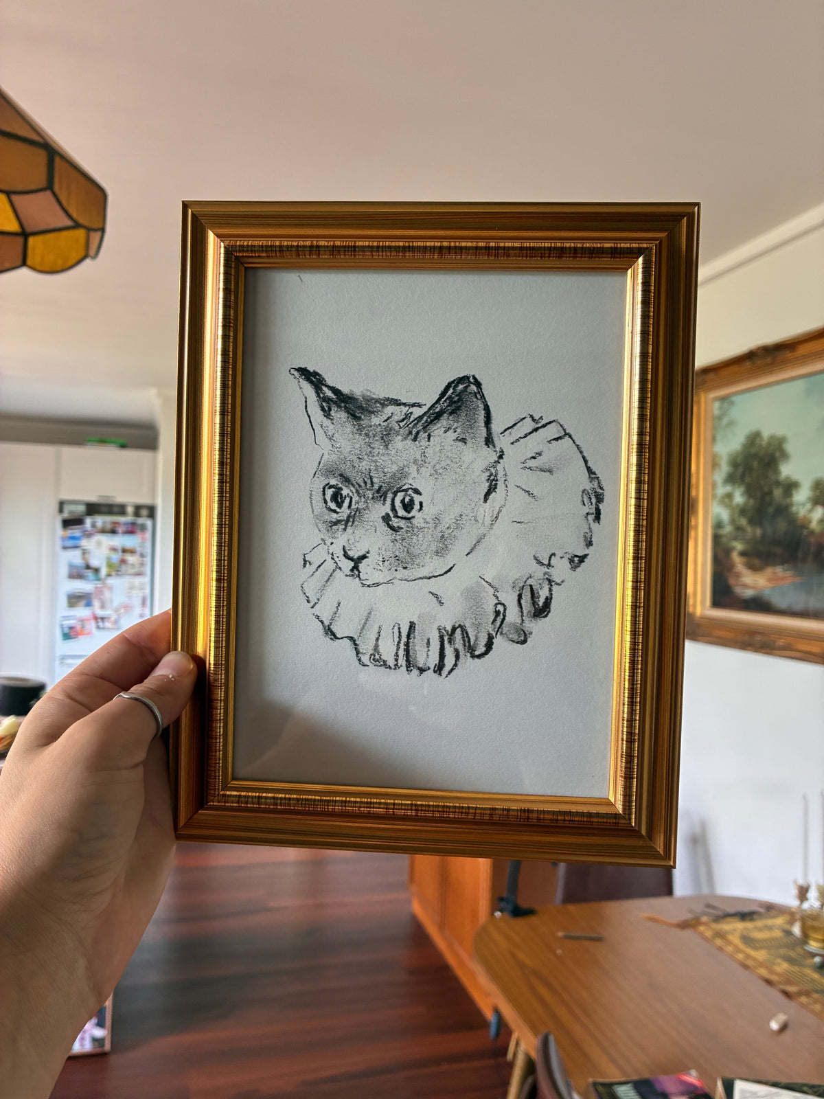 charcoal drawing of a clown cat
