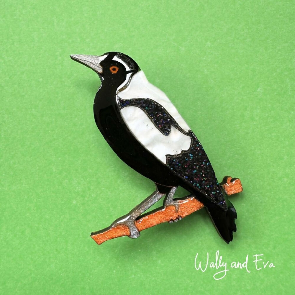 hand-painted-australian-magpie-resin-wood-brooch-on-green