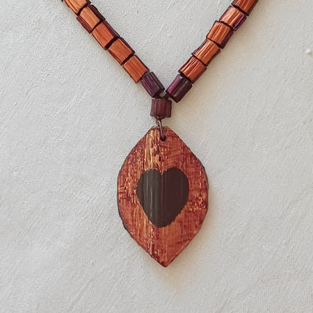 Hand painted Heart pendant on palm leaf bead necklace