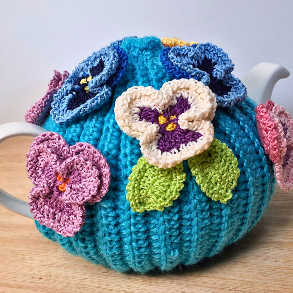 Pansies on a sea of bright blue Medium Teacosy