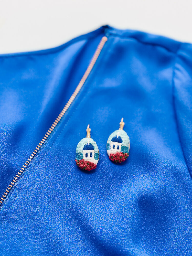 Santorini Hand Embroidered Earrings – Timeless Beauty of the Greek Islands - Oval earrings styled with a blue top