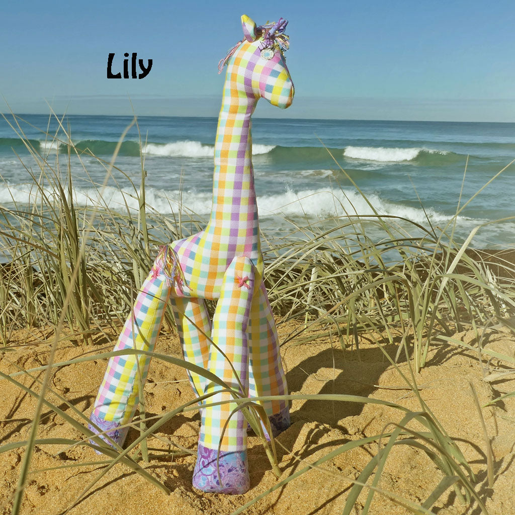 Soft toy giraffes frollicking at the Beach. Hand made.