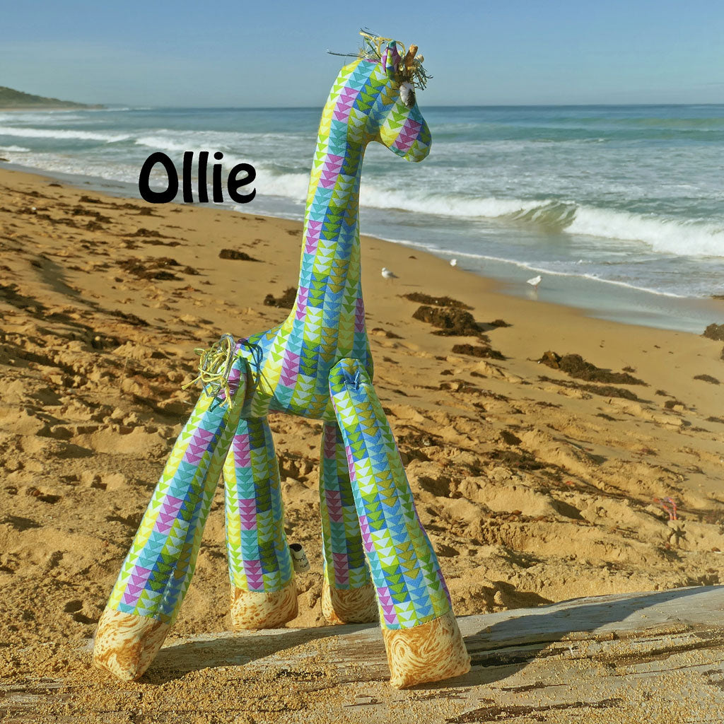 Soft toy giraffes frollicking at the Beach. Hand made.