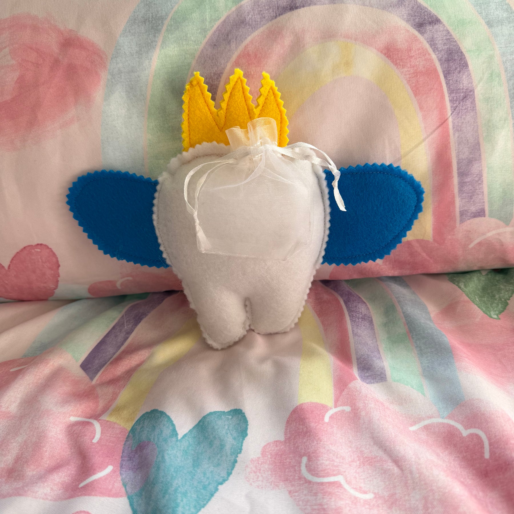 Tooth fairy snuggle toy with tooth pouch
