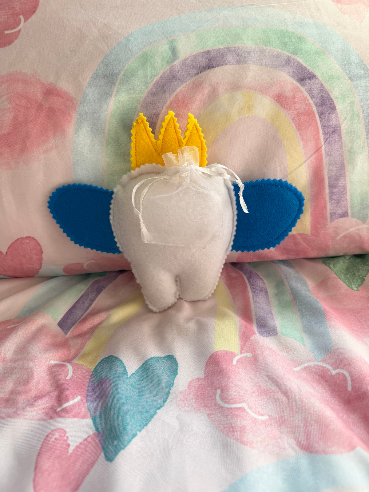 Tooth fairy snuggle toy with tooth pouch