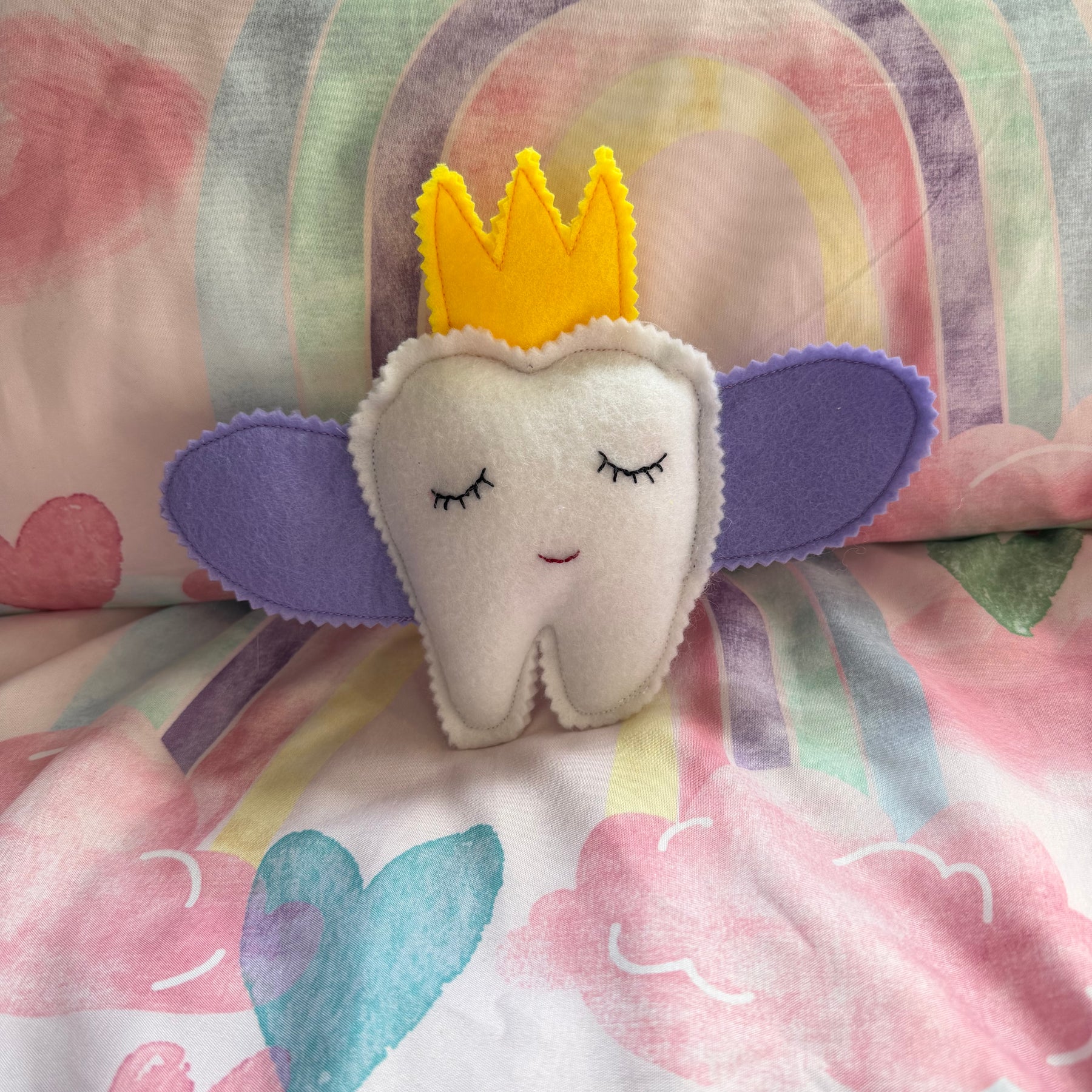 Tooth fairy snuggle toy with tooth pouch