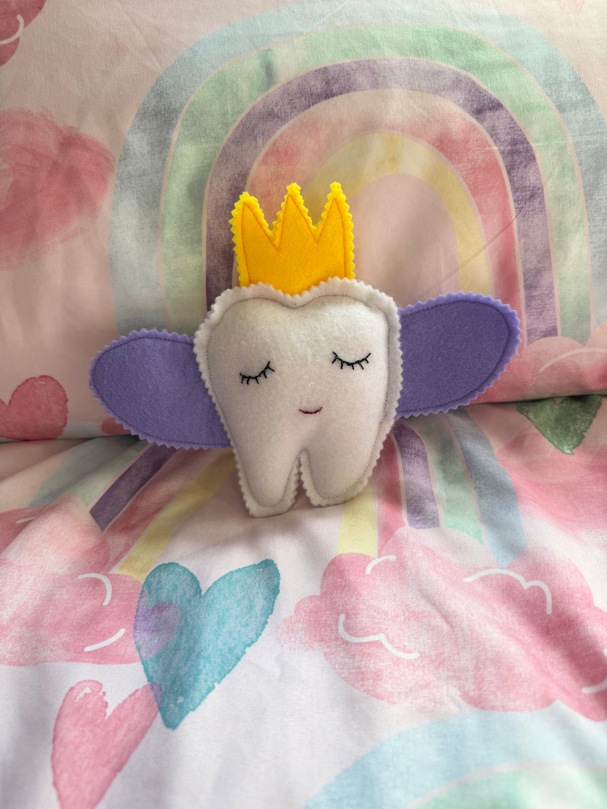 Tooth fairy snuggle toy with tooth pouch