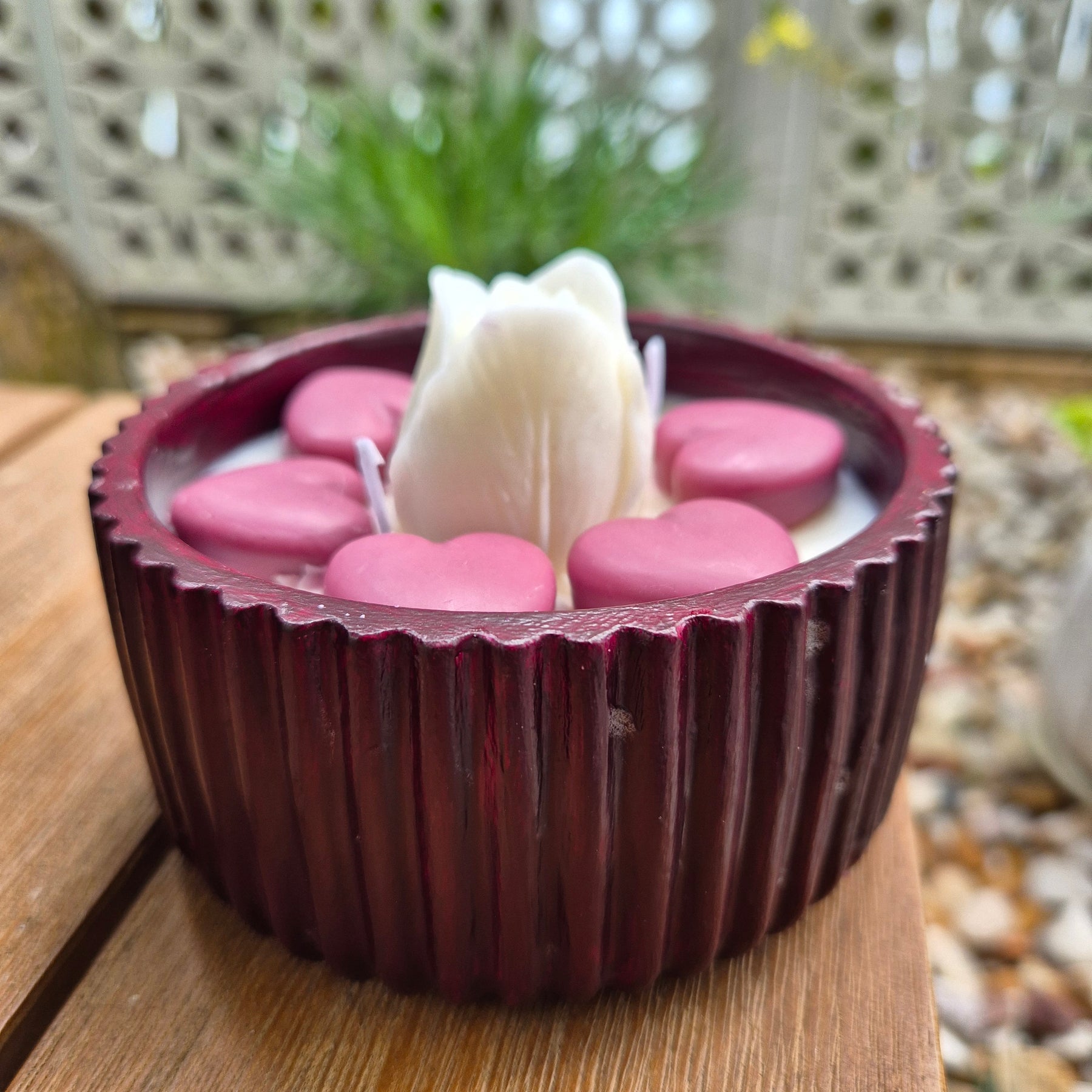 Round burgundy concrete bowl candle with tulip flower