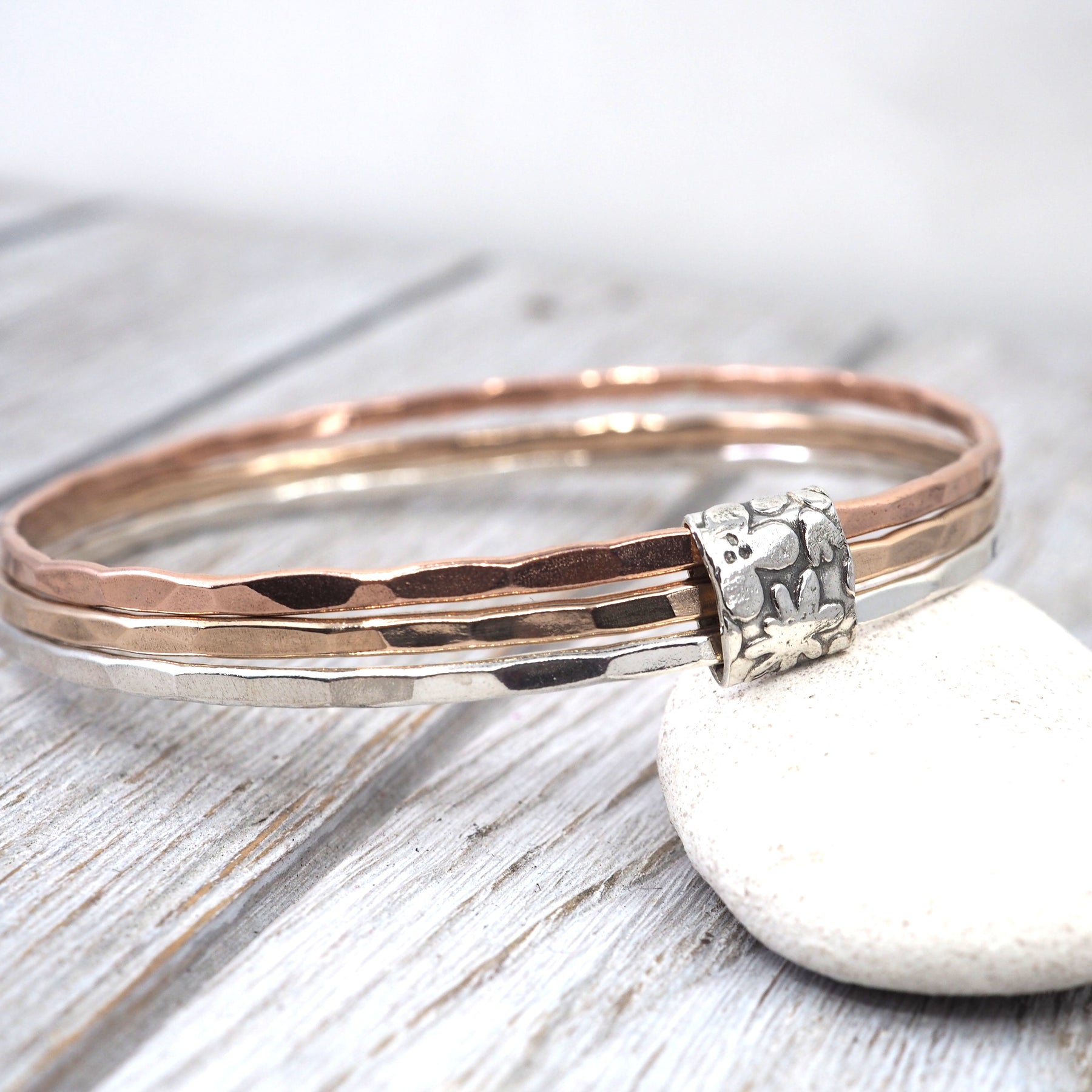 Silver, bronze and copper bangle set