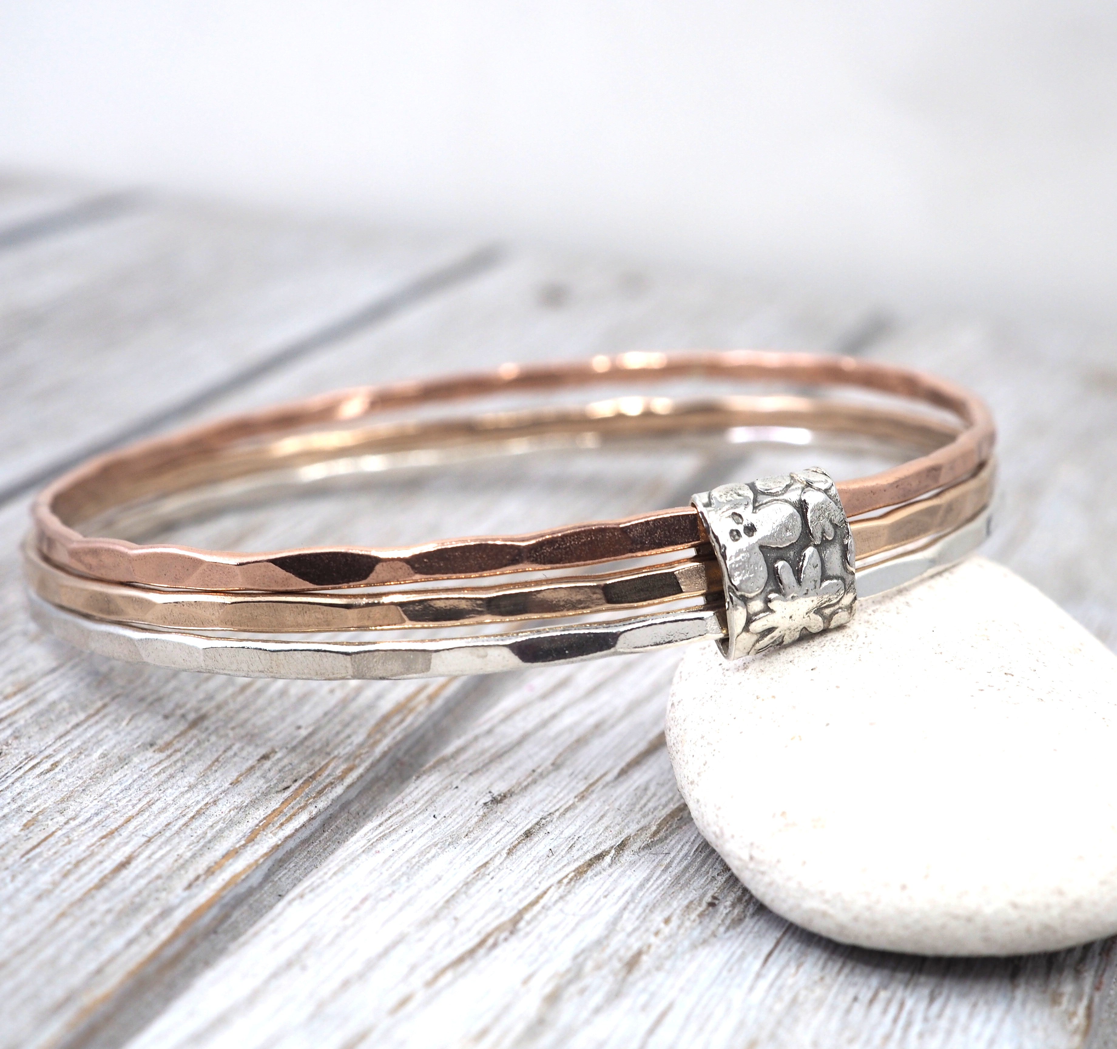 Silver, bronze and copper bangle set