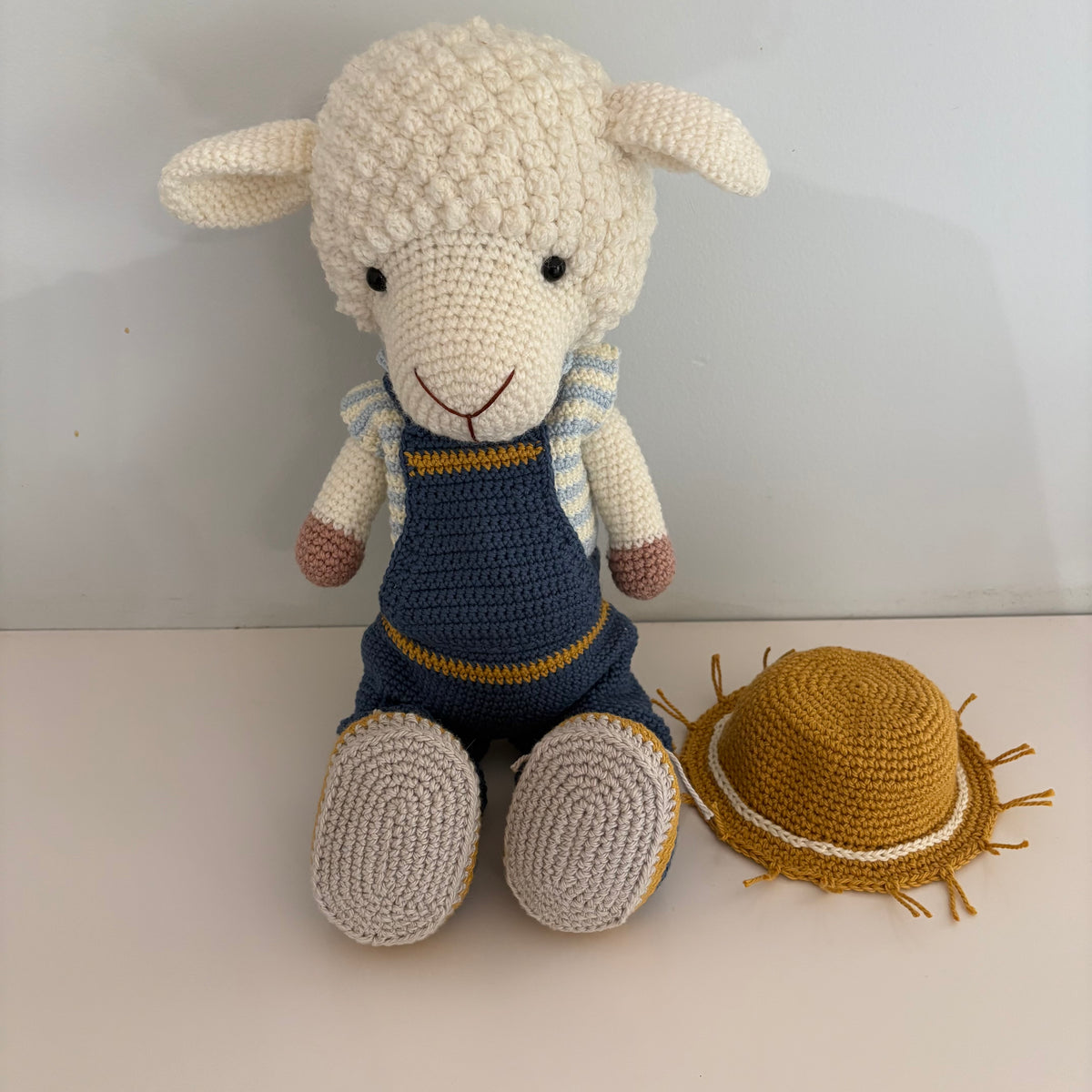 Lamb in overalls and hat