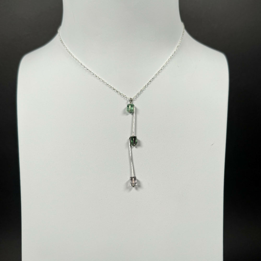 Fluorite-necklace-on-grey-stand