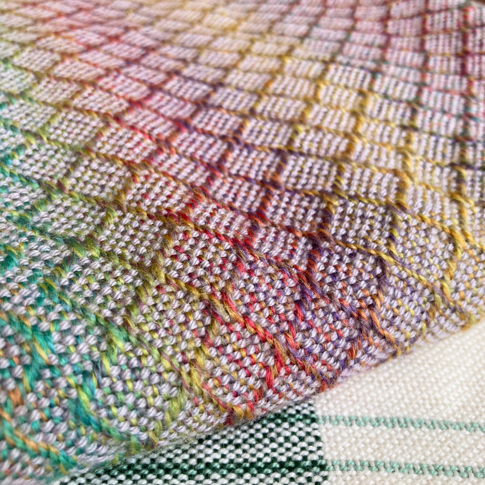 Closeup-foldedcorners-handwoven-baby-blanket-entangledhappinesshandwoven-rainbow