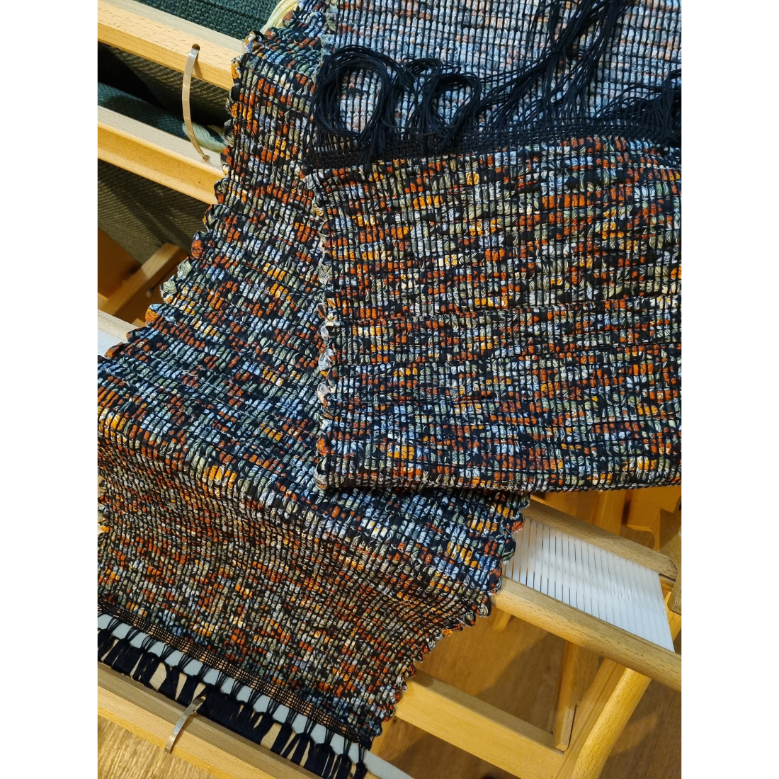 Woven black and orange floral tablerunner