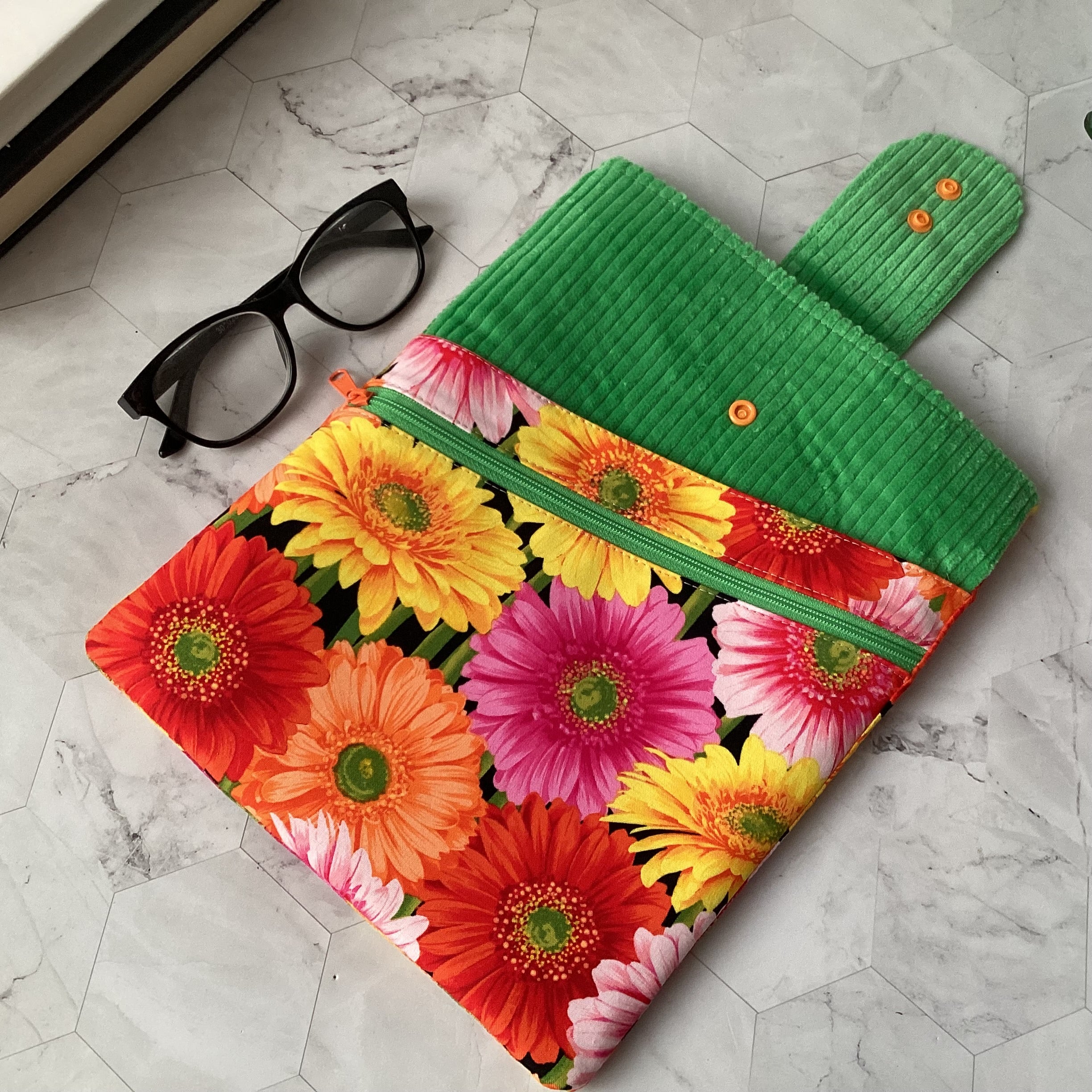 Colourful daisies book sleeve with 2 pockets. iPad, tablet pouch