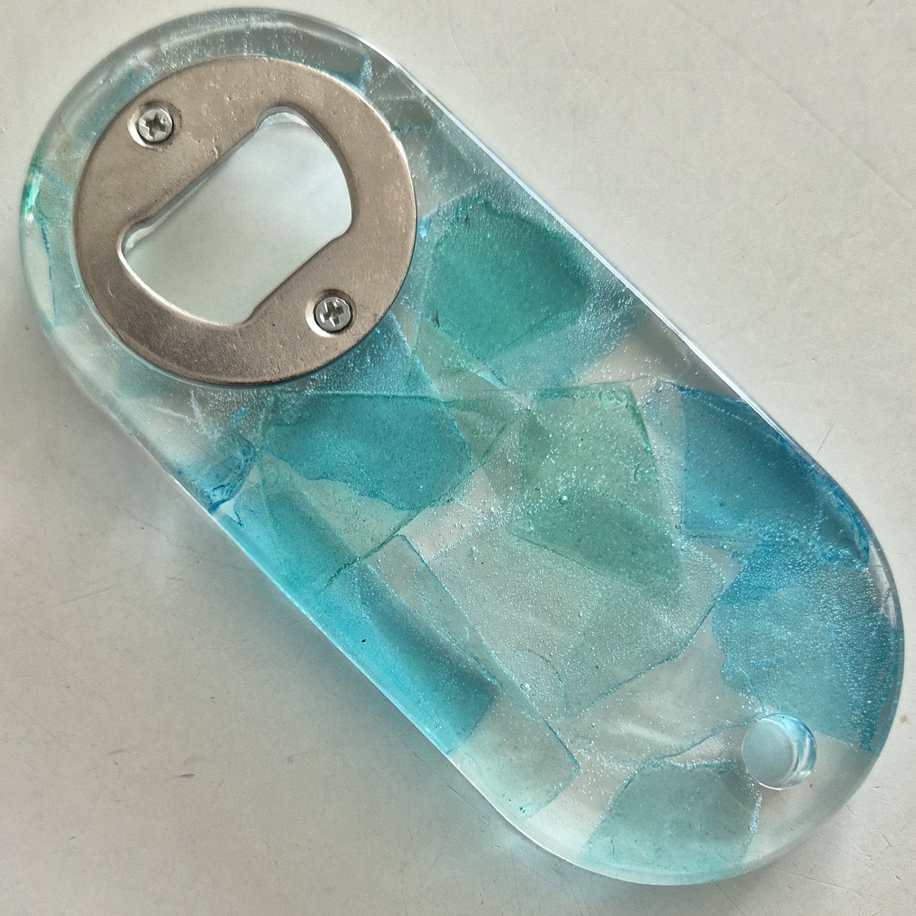 Resin bottle openers with inlaid semi-precious gemstones or sea glass