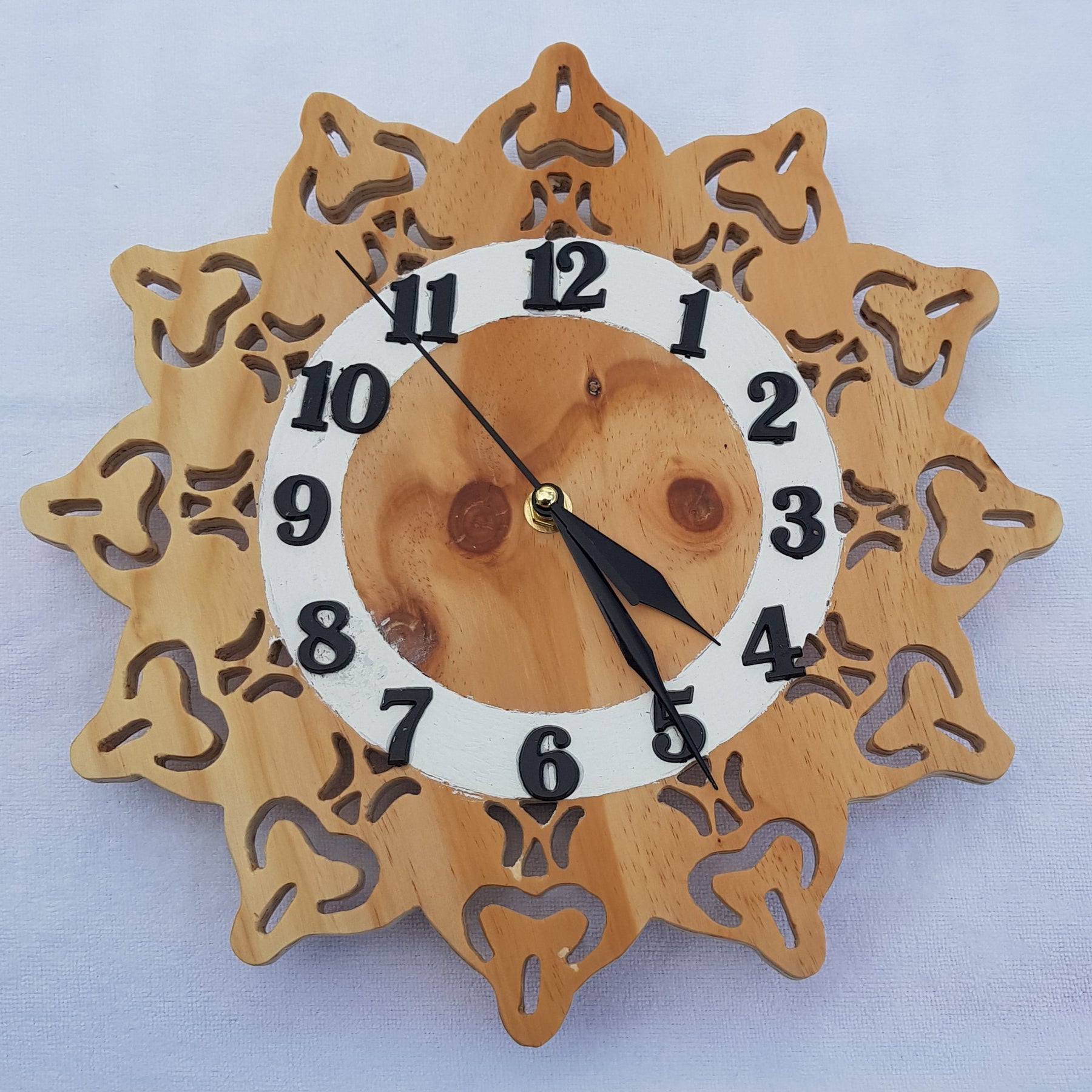 Clock 7: Features a knotty pine facard.