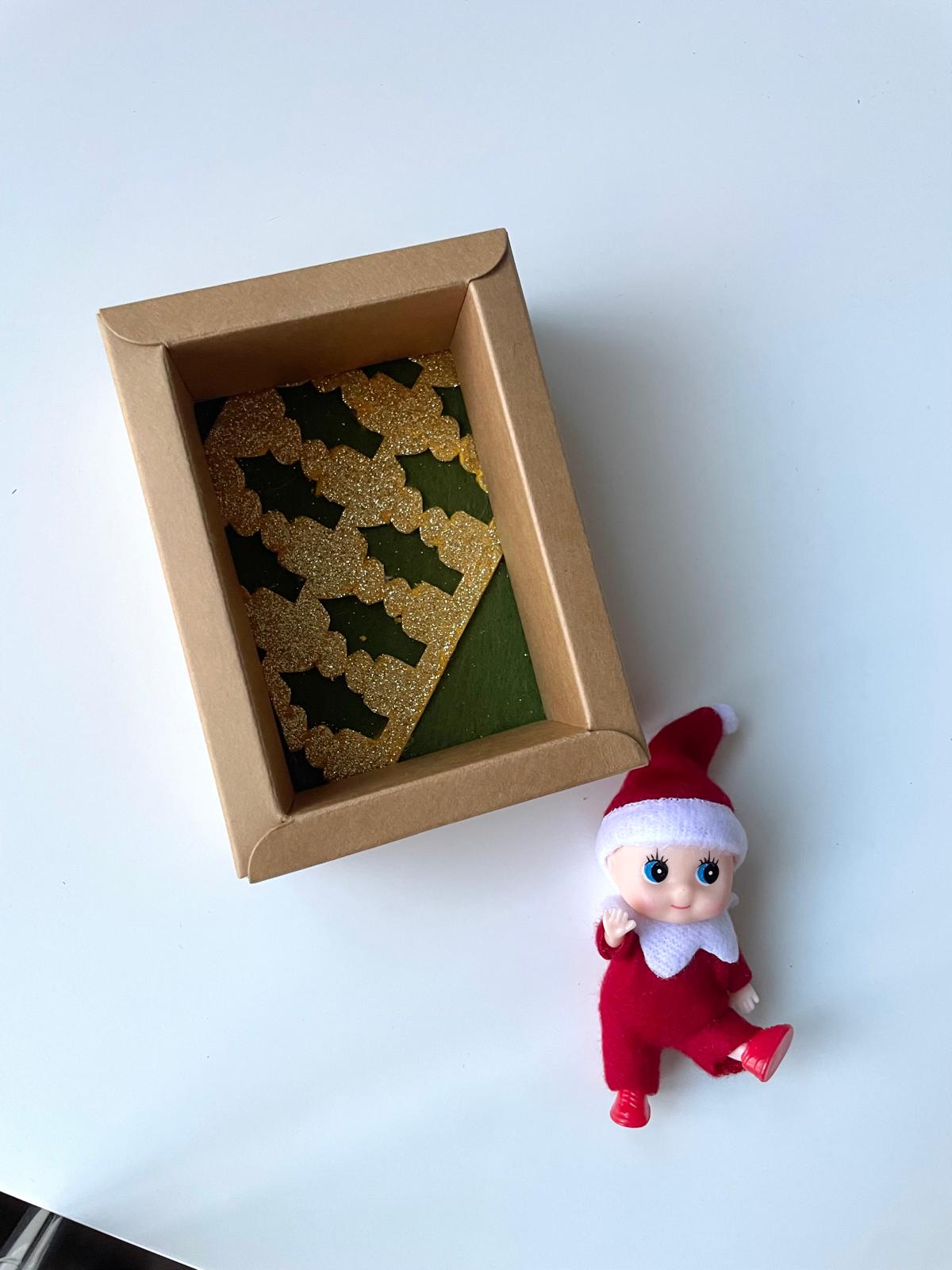 Little Elf on shelf in a keepsake box