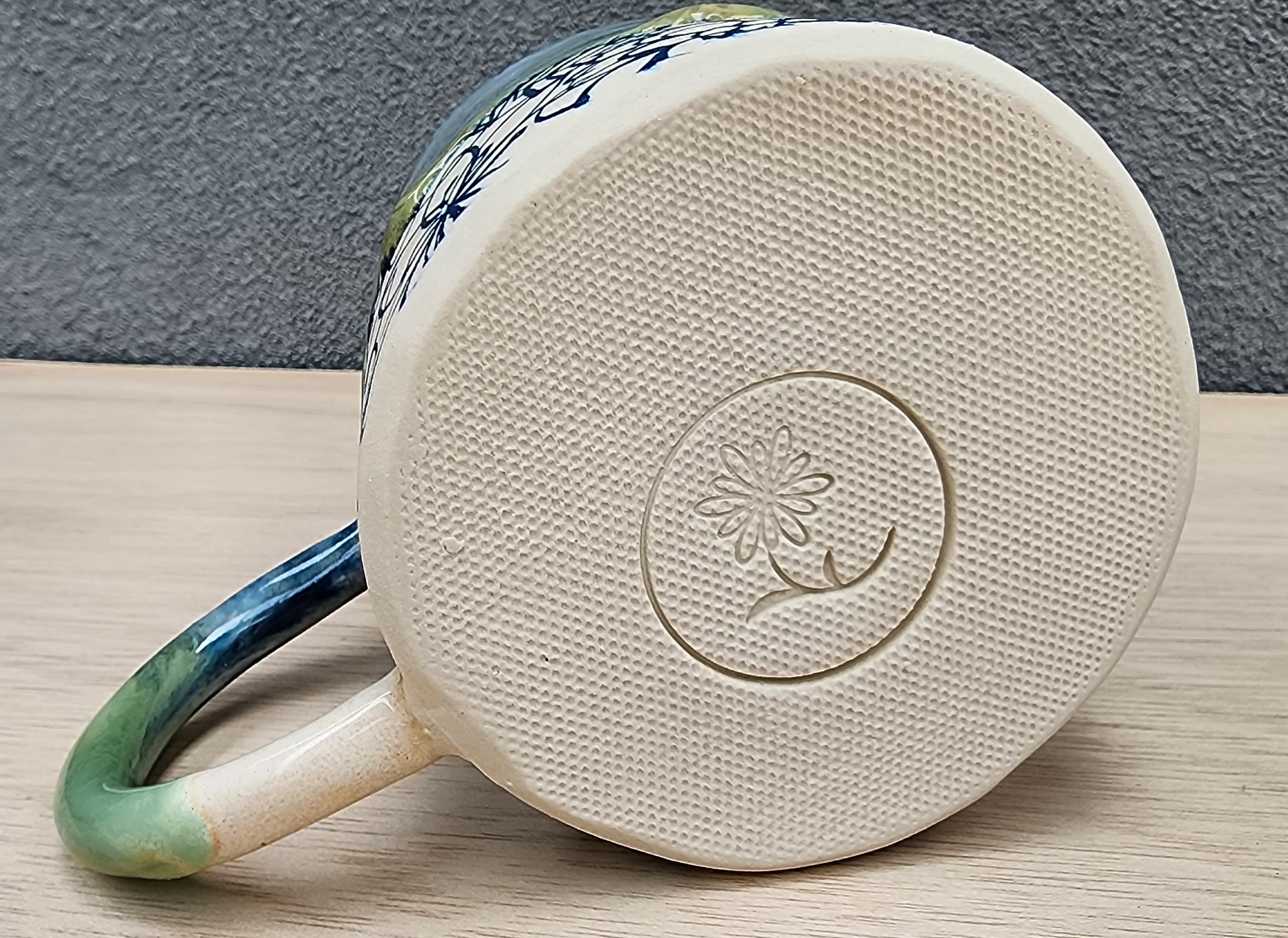 Ceramic floral mug with drippy glaze