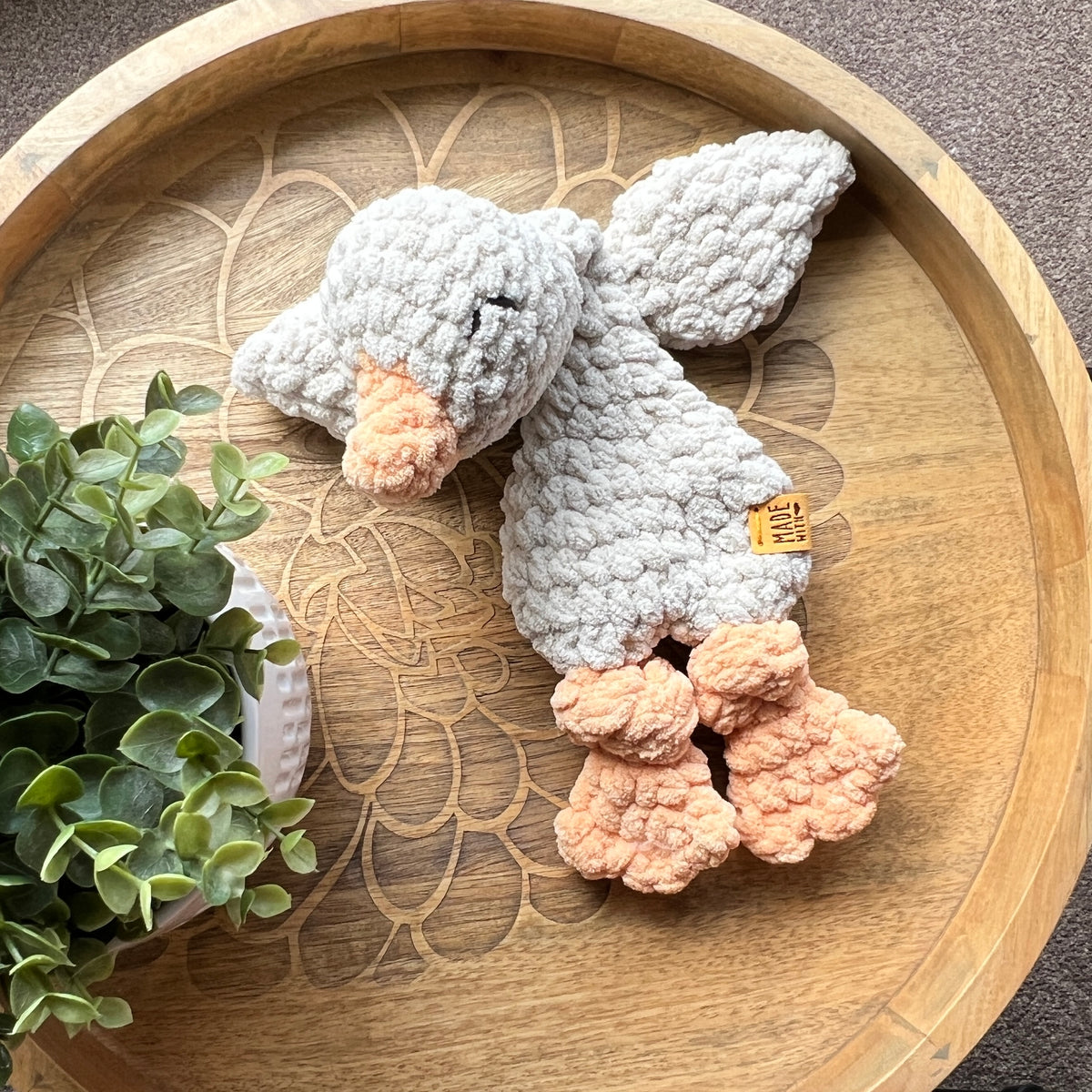 Handmade crochet Mini Goose modern lovey with knotted legs.