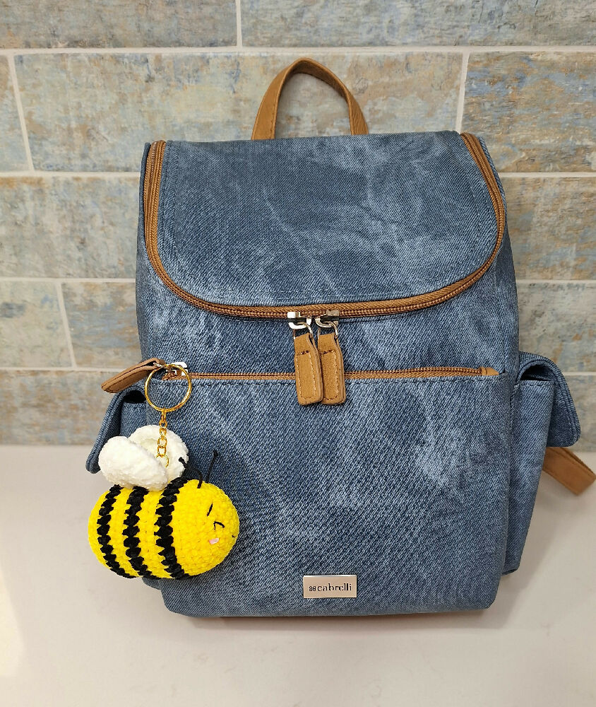bee keychain on backpack