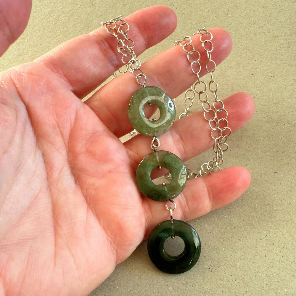 Moss agate necklace on hand