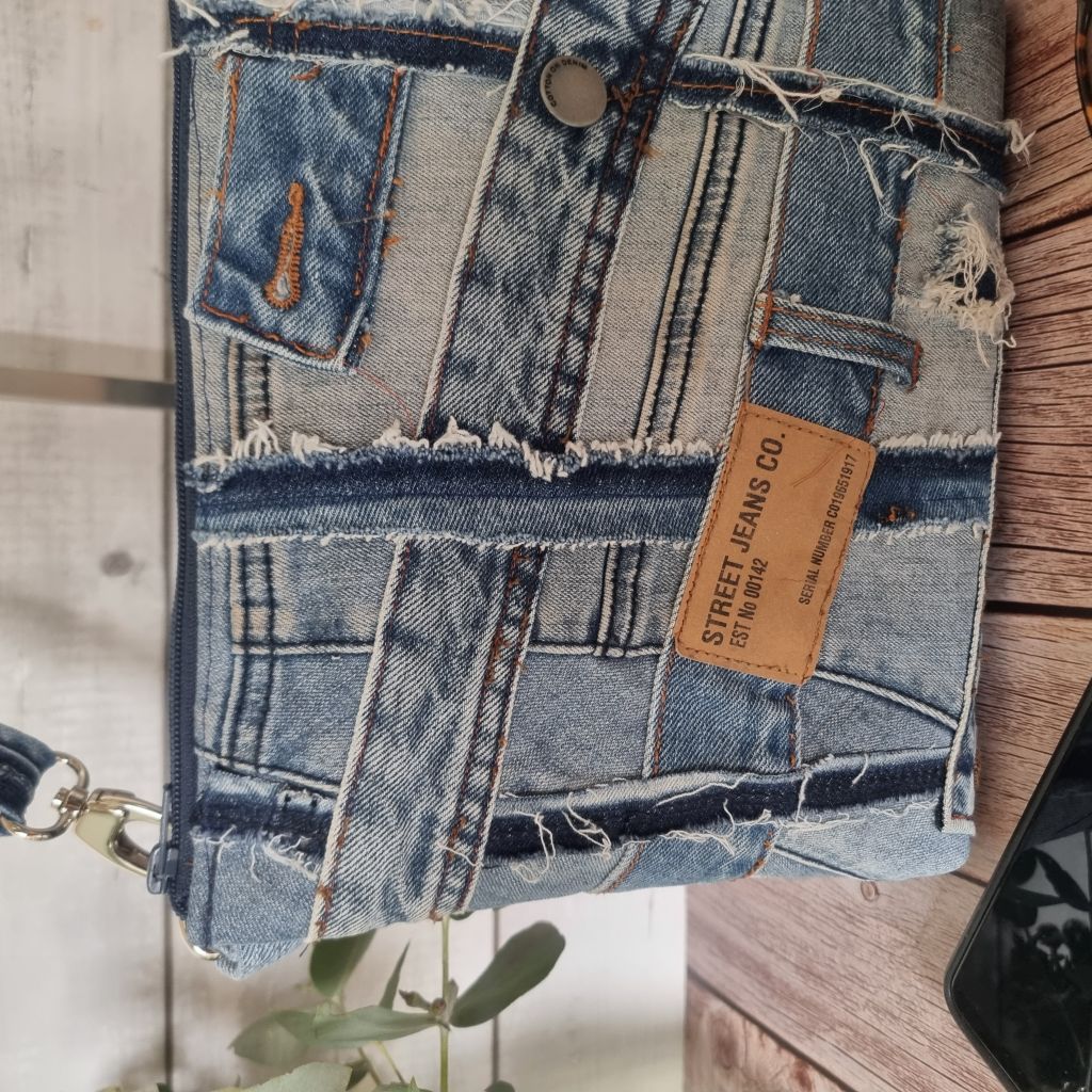 Handmade upcycled angle patched denim zip crossbody bag