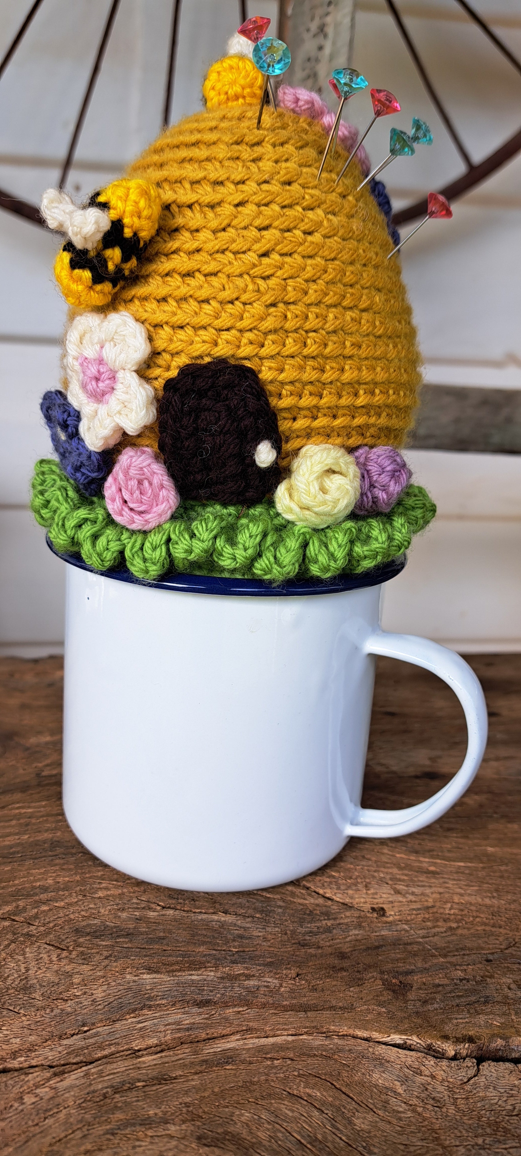 Beehive pin cushion in a sturdy enamel tin mug