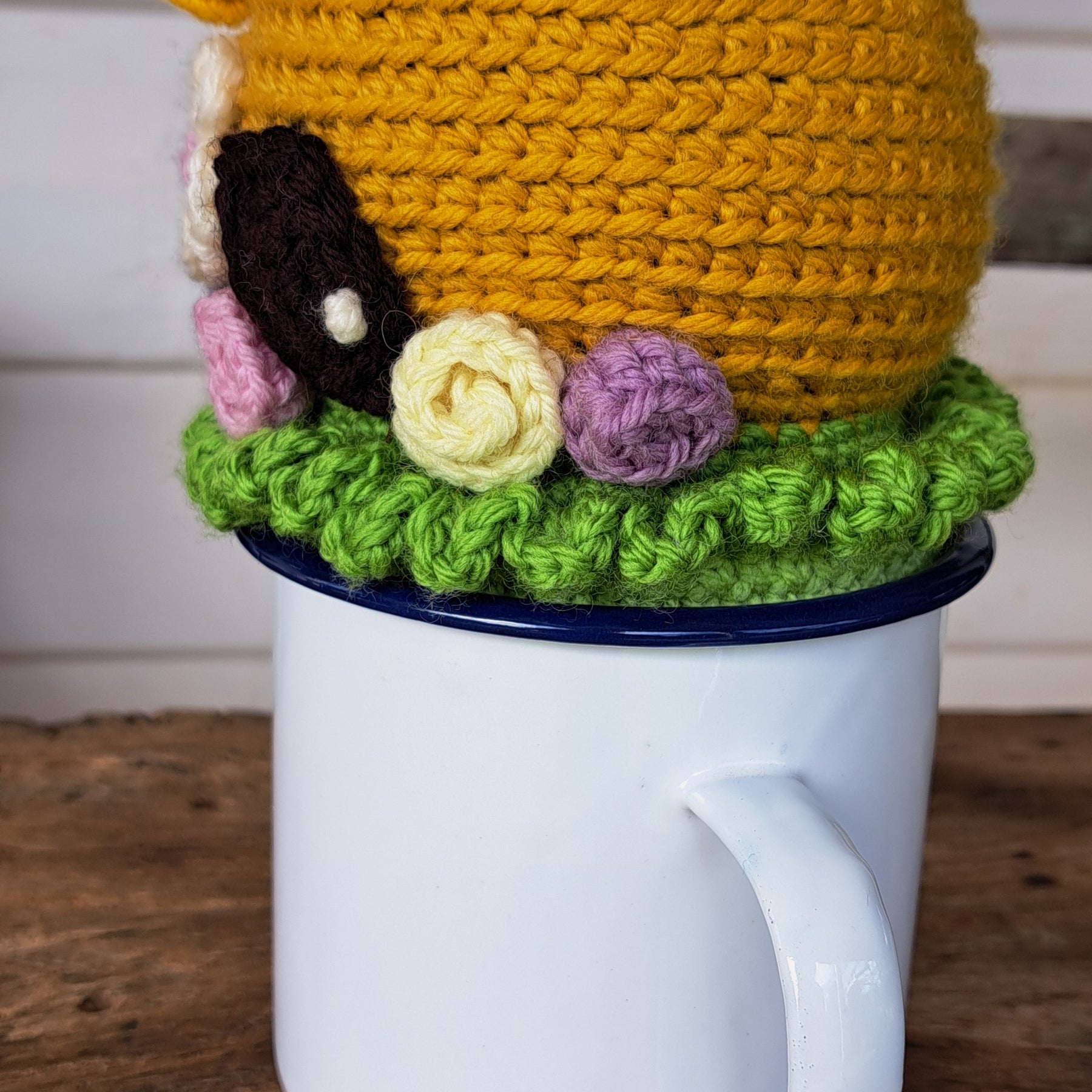 Beehive pin cushion in a sturdy enamel tin mug