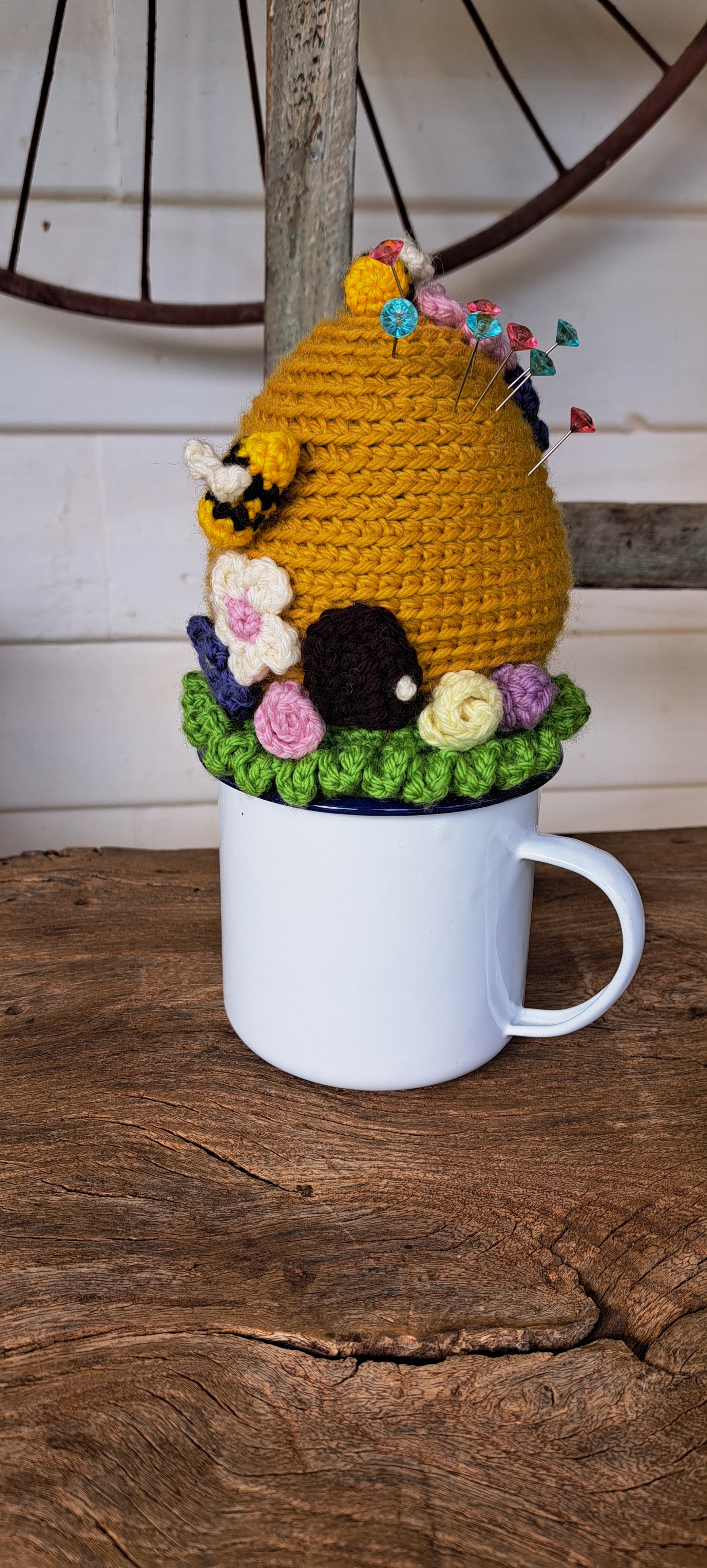 Beehive pin cushion in a sturdy enamel tin mug