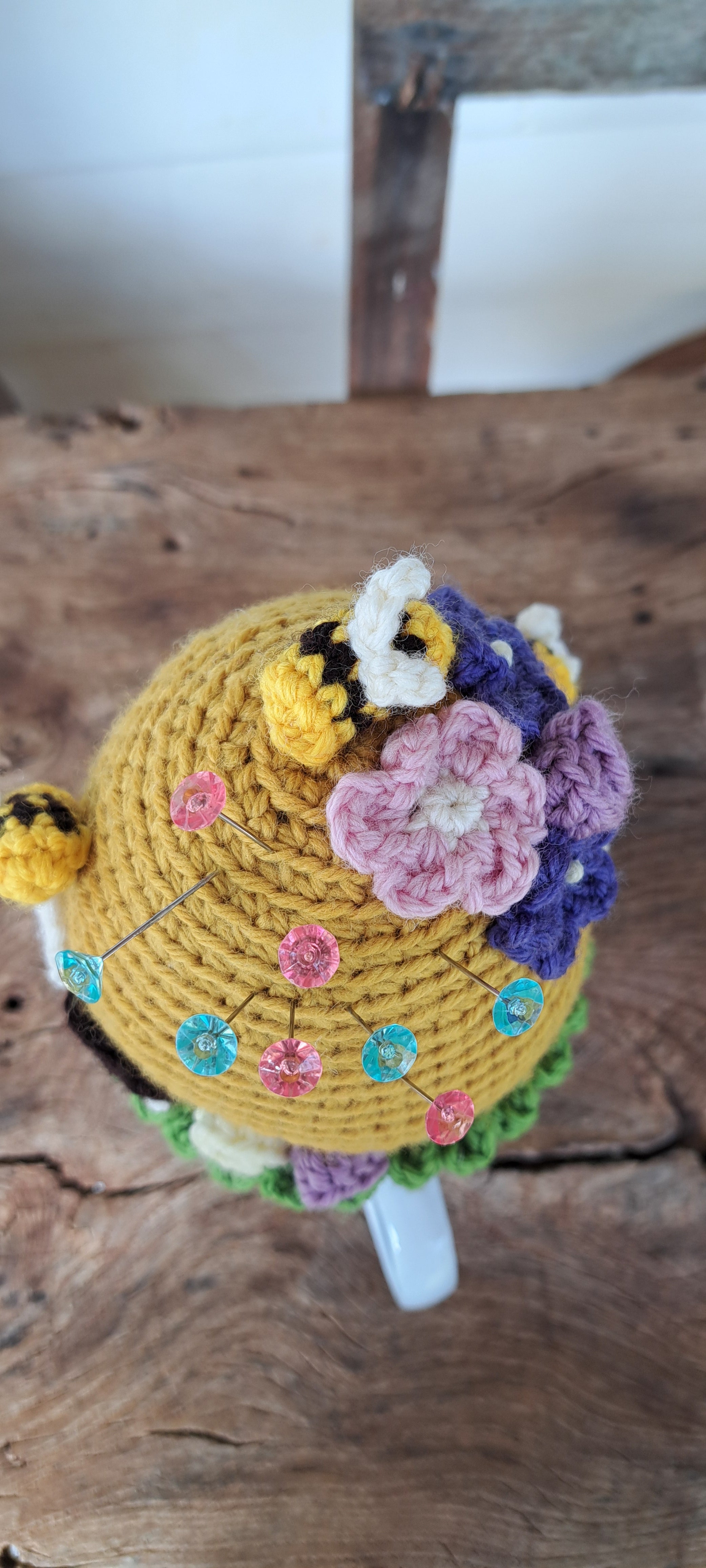 Beehive pin cushion in a sturdy enamel tin mug