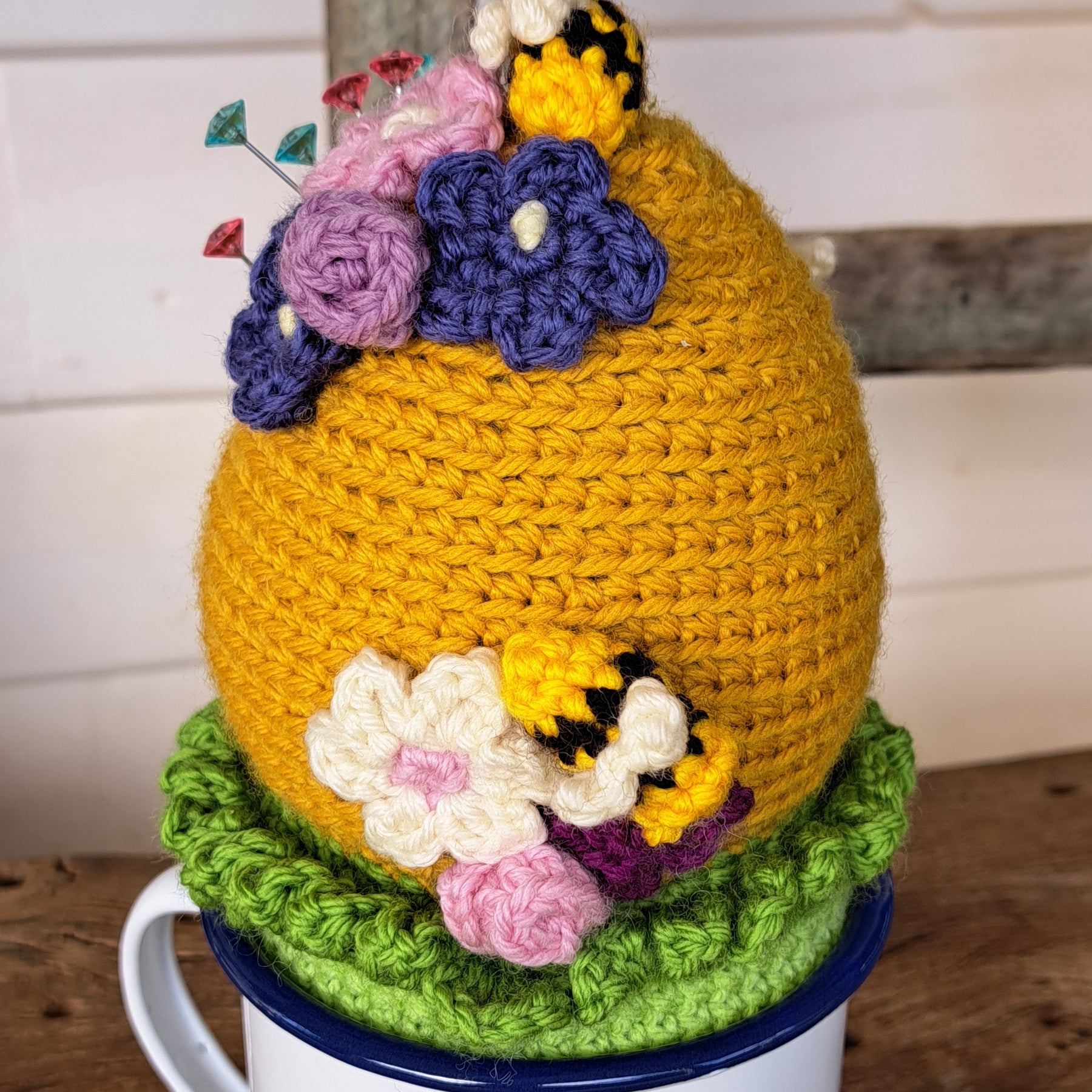 Beehive pin cushion in a sturdy enamel tin mug