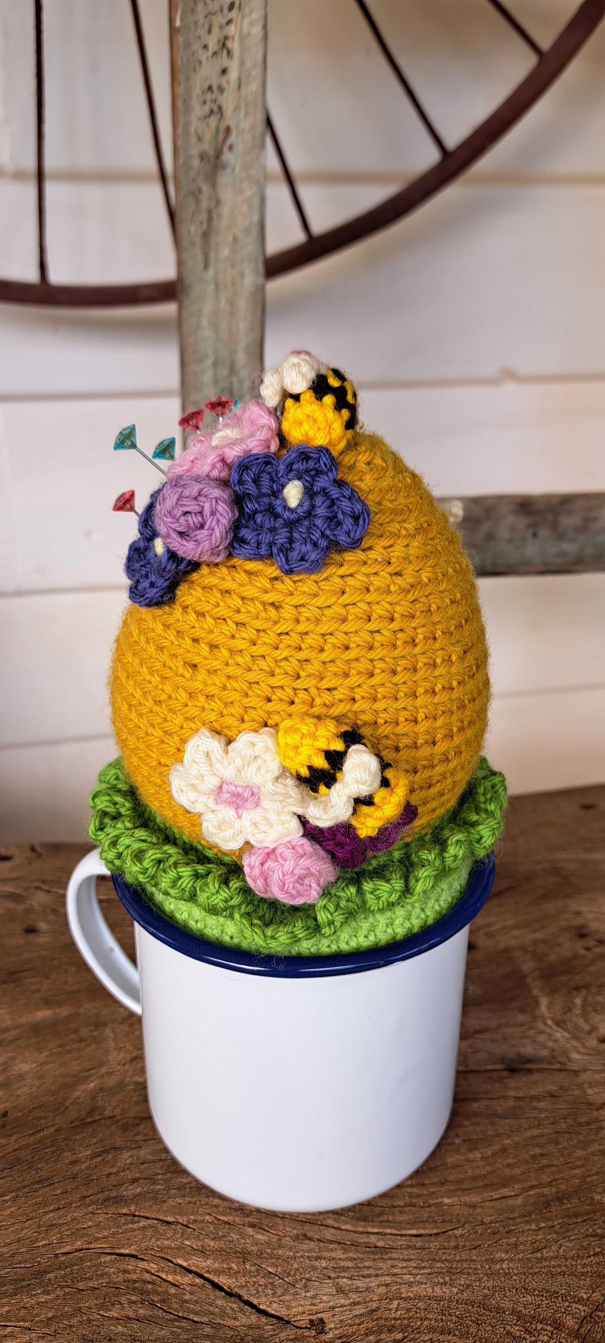 Beehive pin cushion in a sturdy enamel tin mug