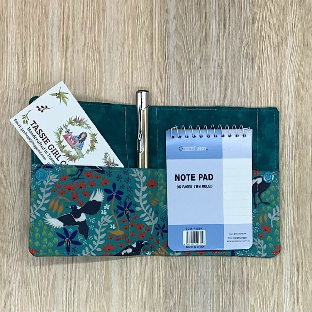 Magpie refillable fabric pocket notepad cover with snap closure. Incl. book and pen.