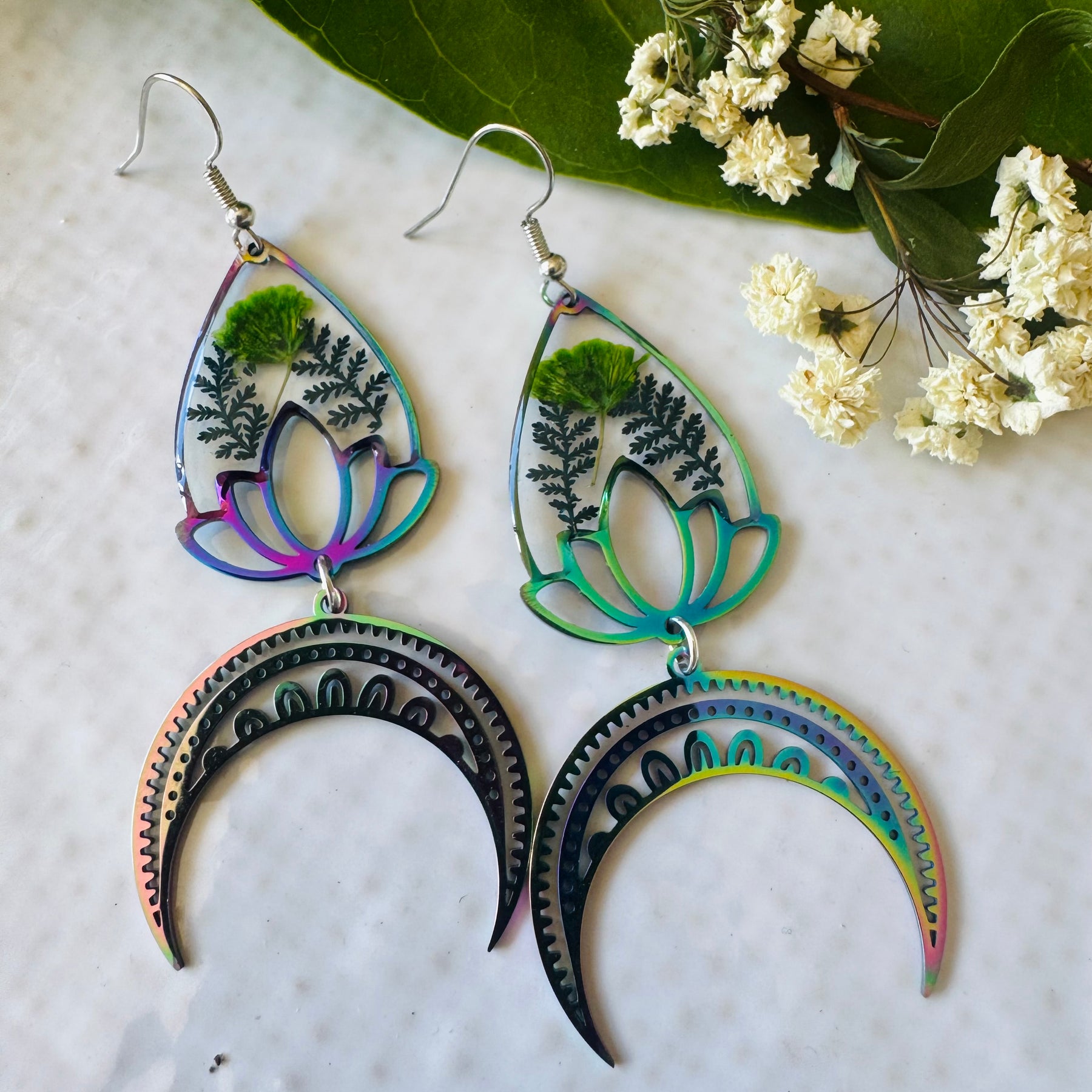 Iridescent rainbow resin earrings with pressed flowers