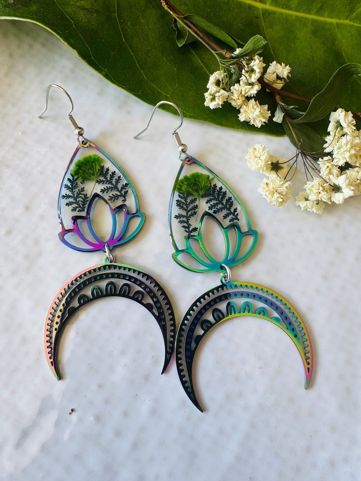 Iridescent rainbow resin earrings with pressed flowers