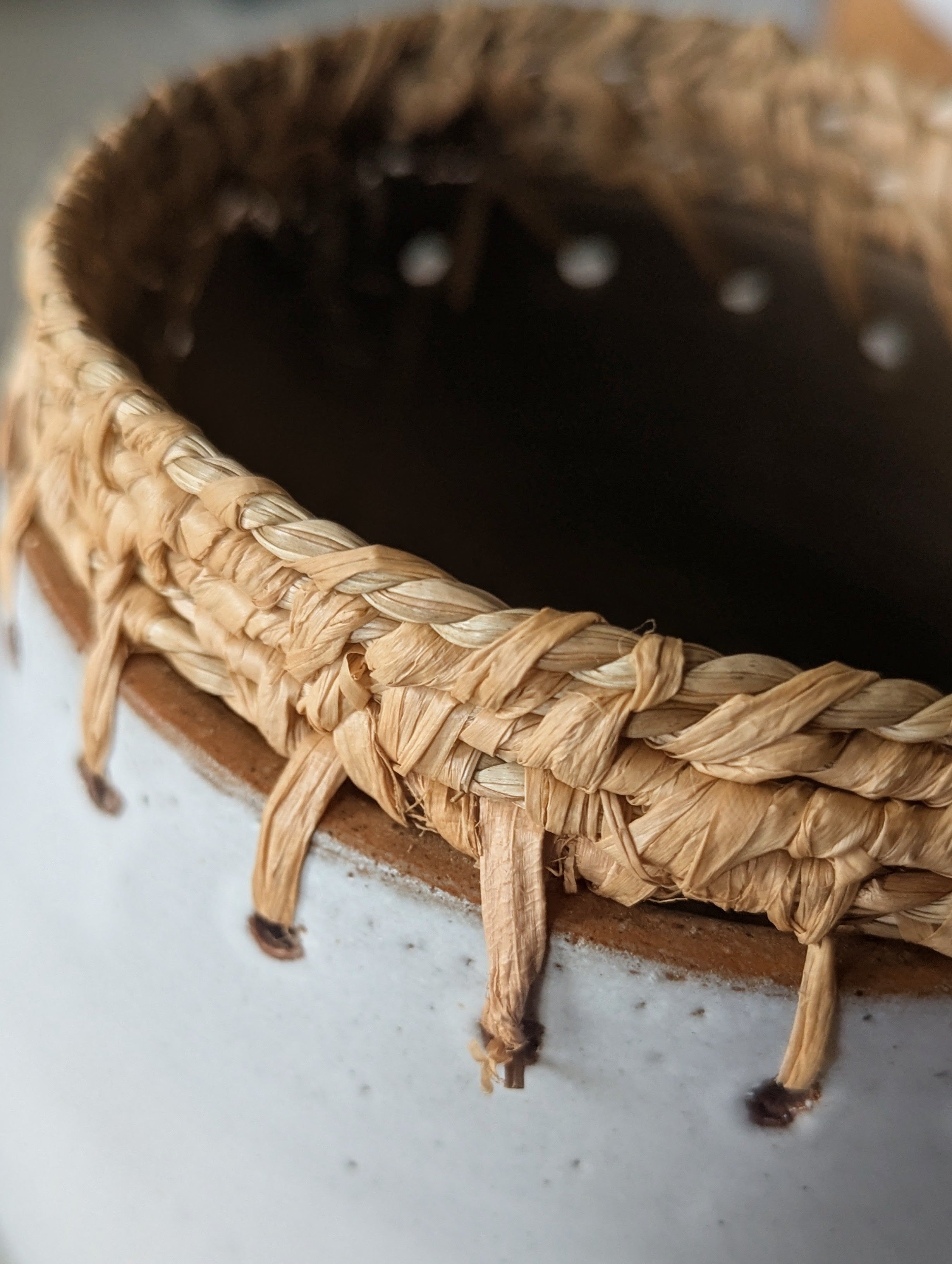 Circular Clay Pots with Woven Plant Fibres
