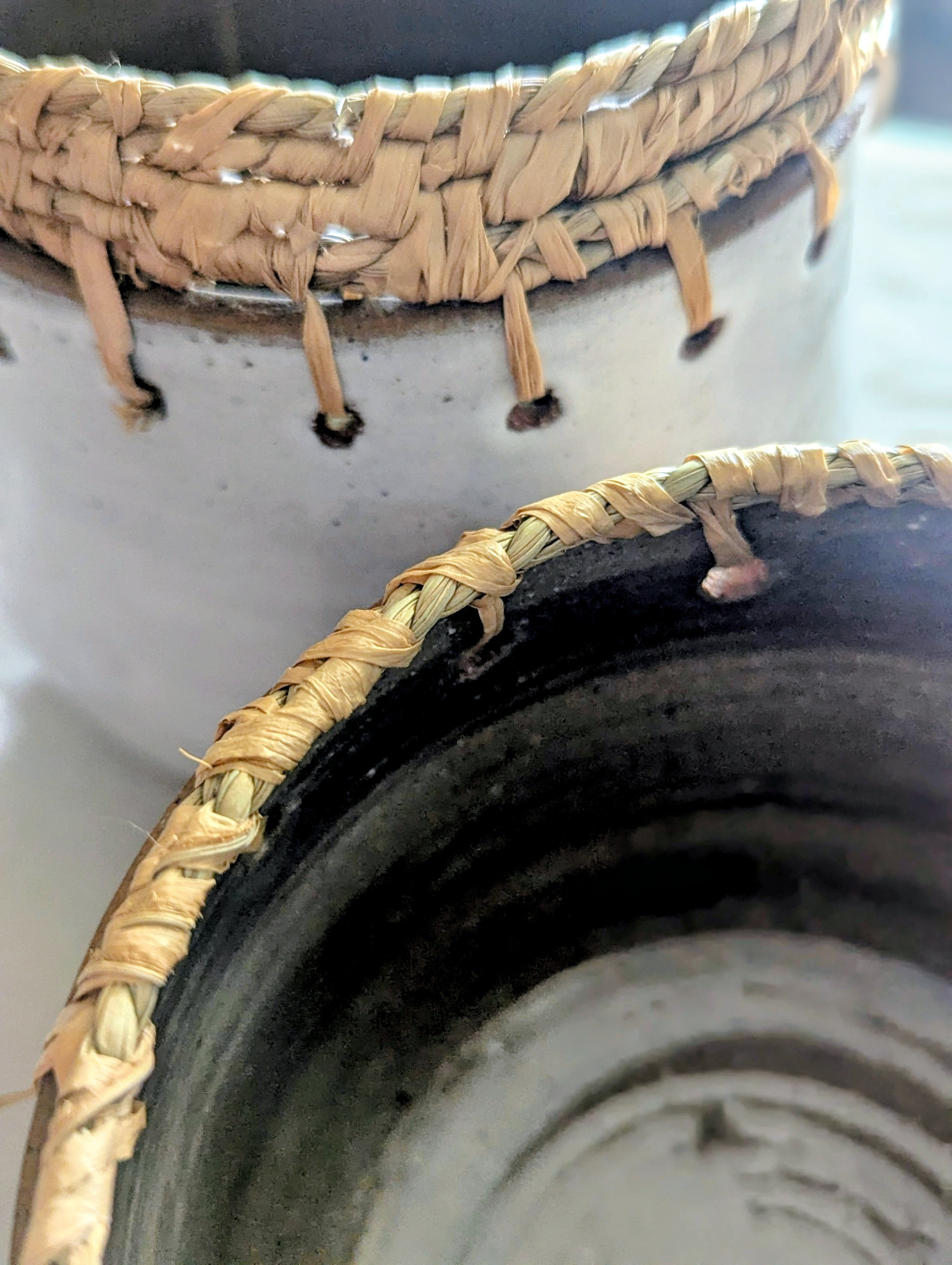 Circular Clay Pots with Woven Plant Fibres