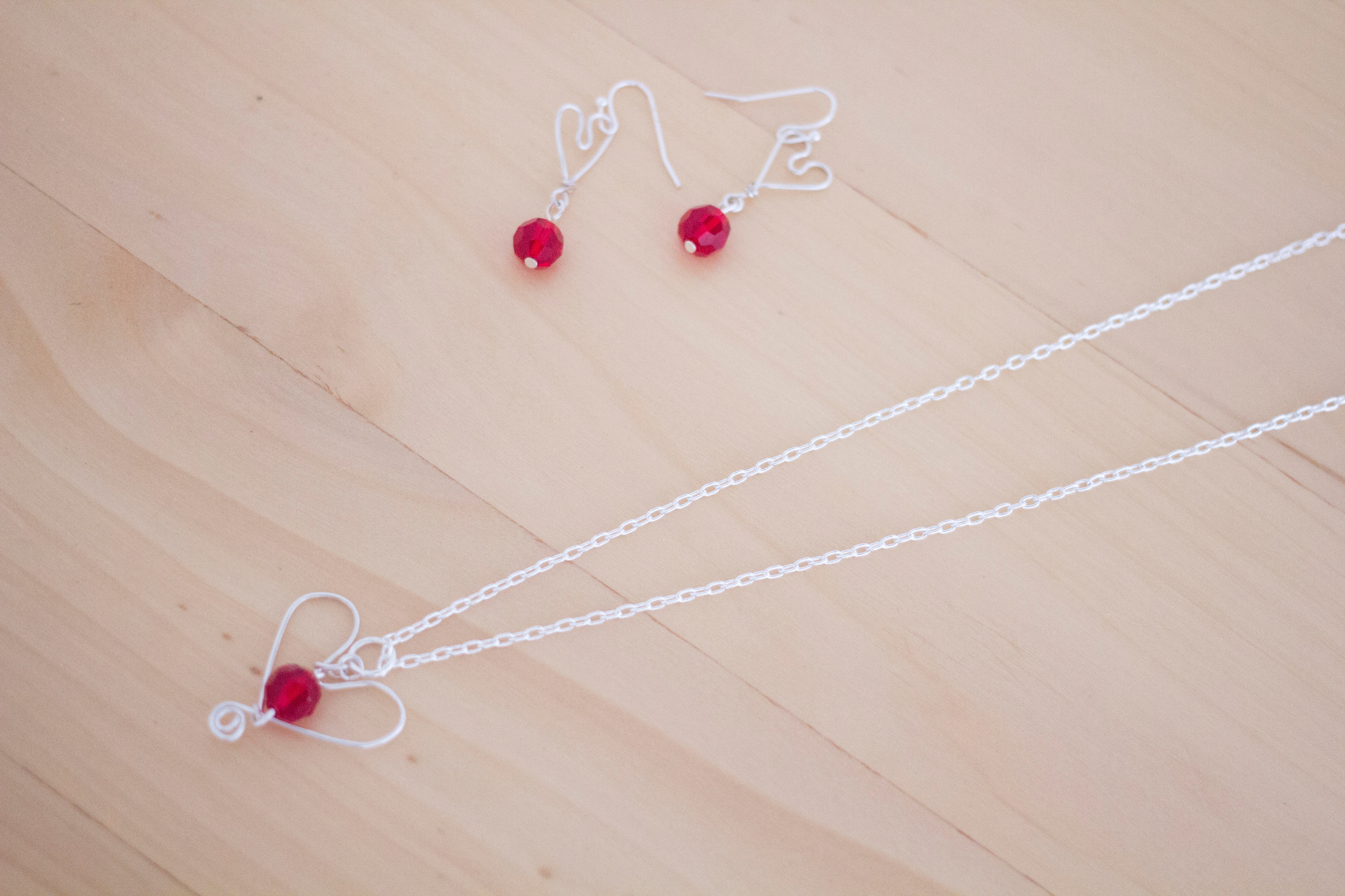 Silver Heart and Red Crystal Pendant Necklace and Earrings Set