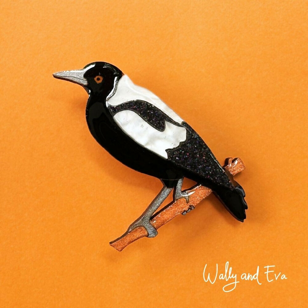 hand-painted-australian-magpie-resin-wood-brooch-on-orange