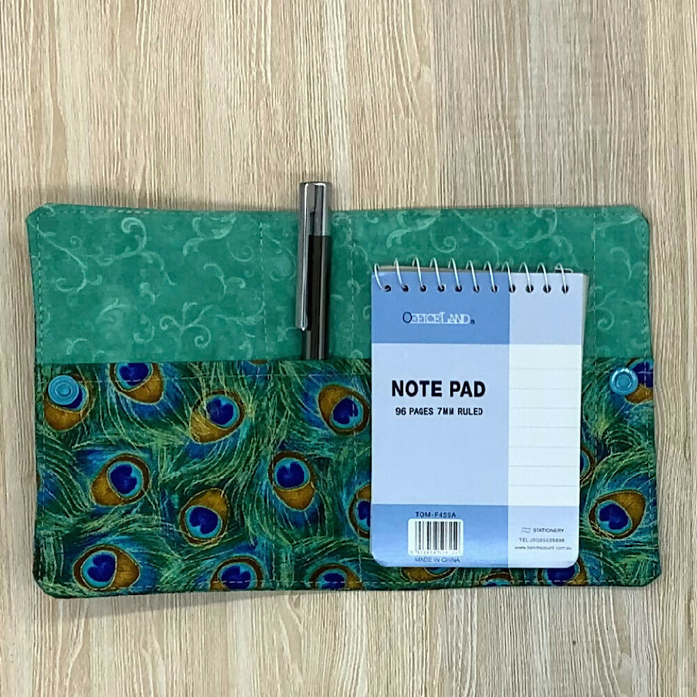 Peacock feathers refillable fabric pocket notepad cover with snap closure. Incl. book and pen.