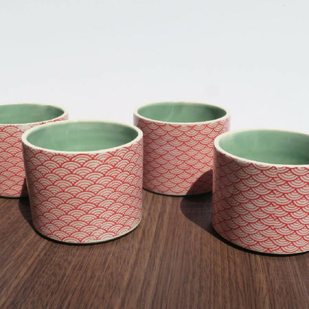 Red stenciled ceramic planters