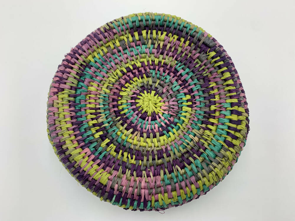 Basket in lime green, blue and purples shades of raffia