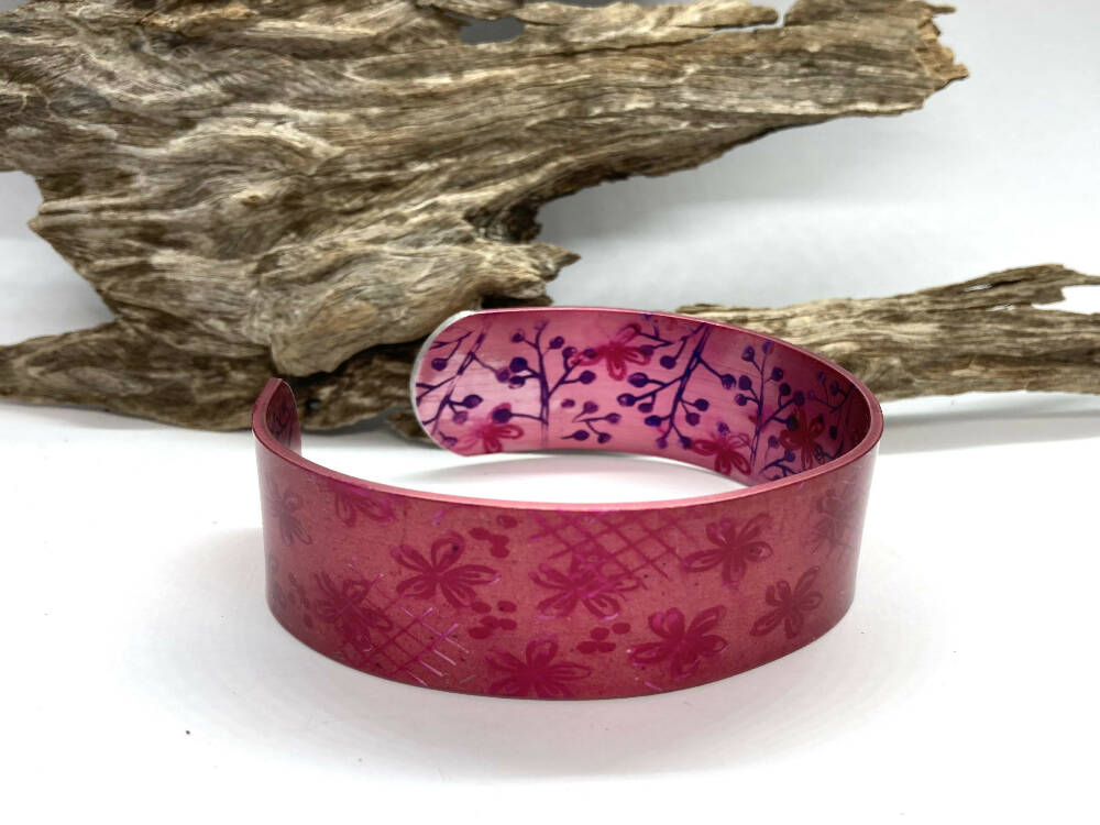 Printed and dyed pink on pink anodised aluminium bangle