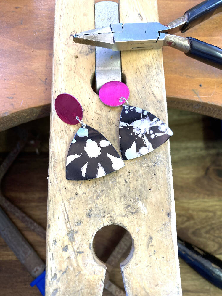 Black printed anodised aluminium earrings with pink studs