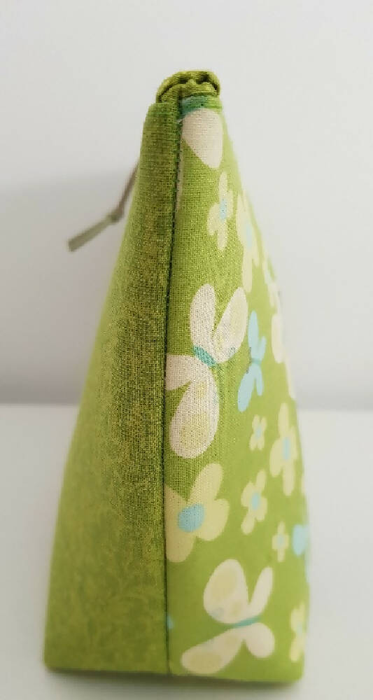Bright green zippered bag/pouch.