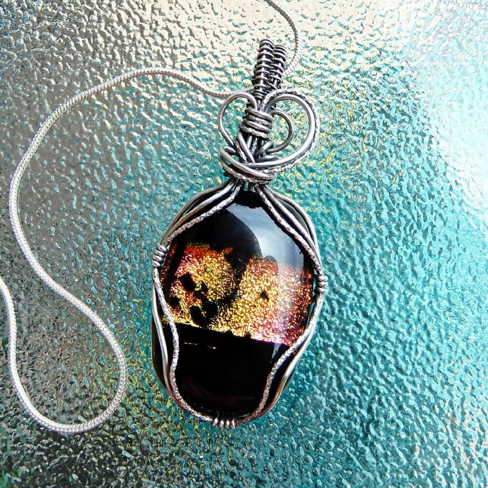 Dichroic glass pendant oxidised Sterling silver wrapped