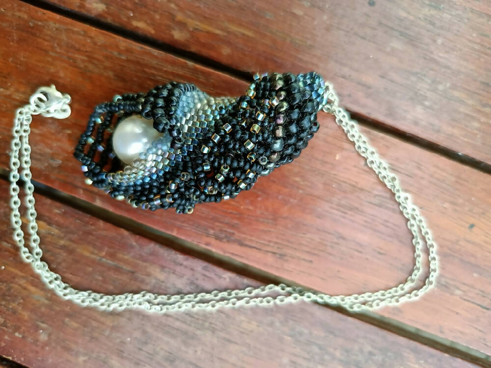 Handmade seed beaded seashell with faux pearl inside, on silver chain