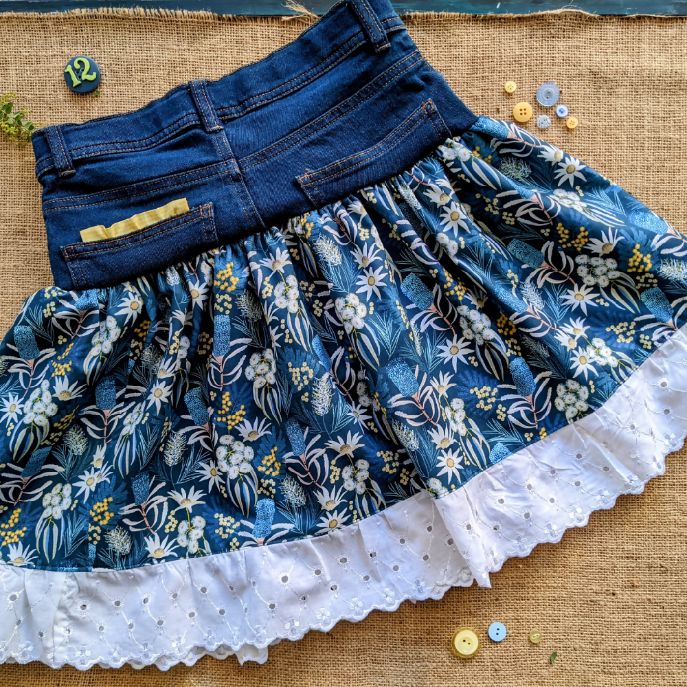 Size 12 Girls denim skirt with flannel flowers